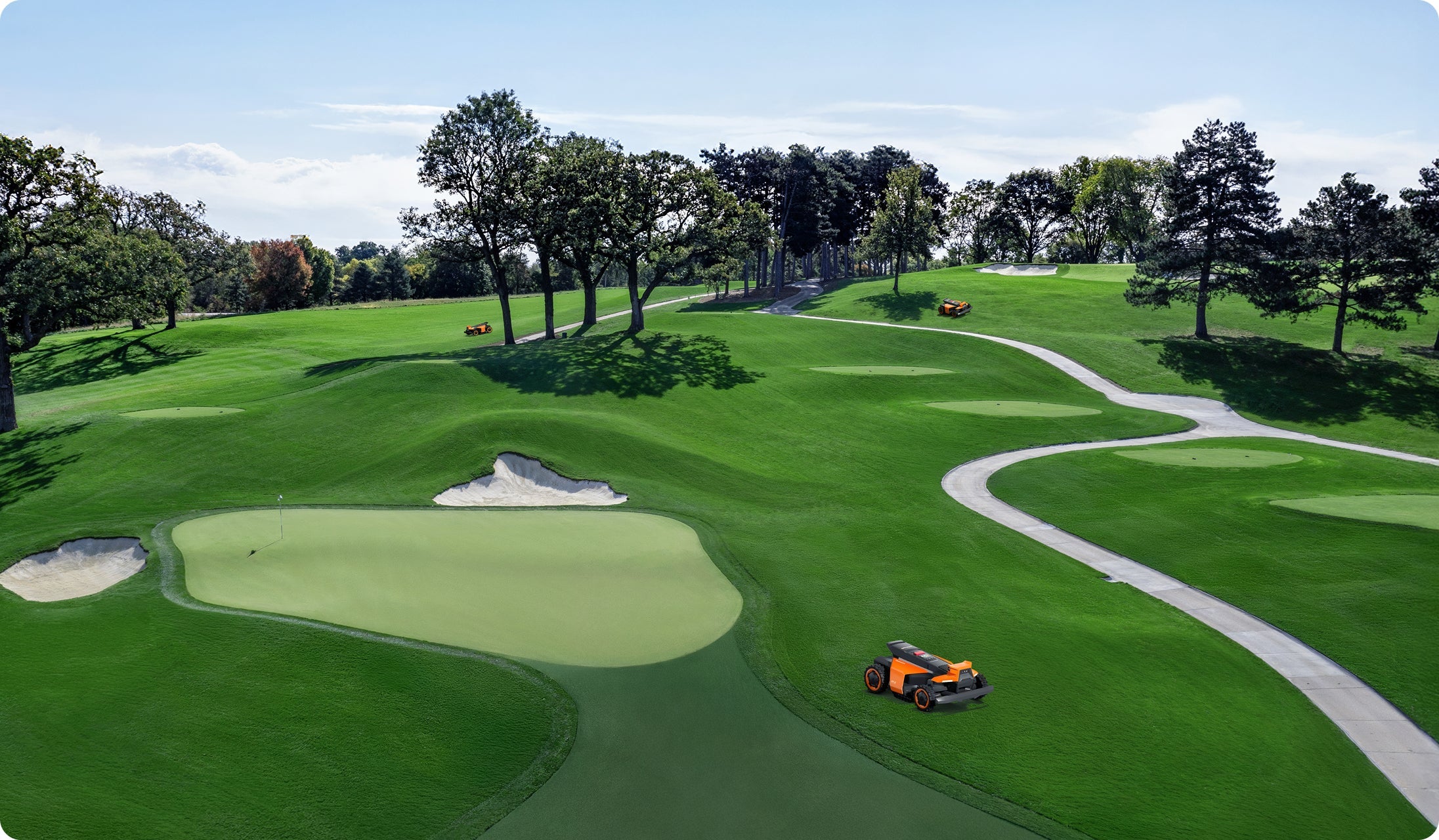 Segway Navimow i Series robot lawn mowers on a green.