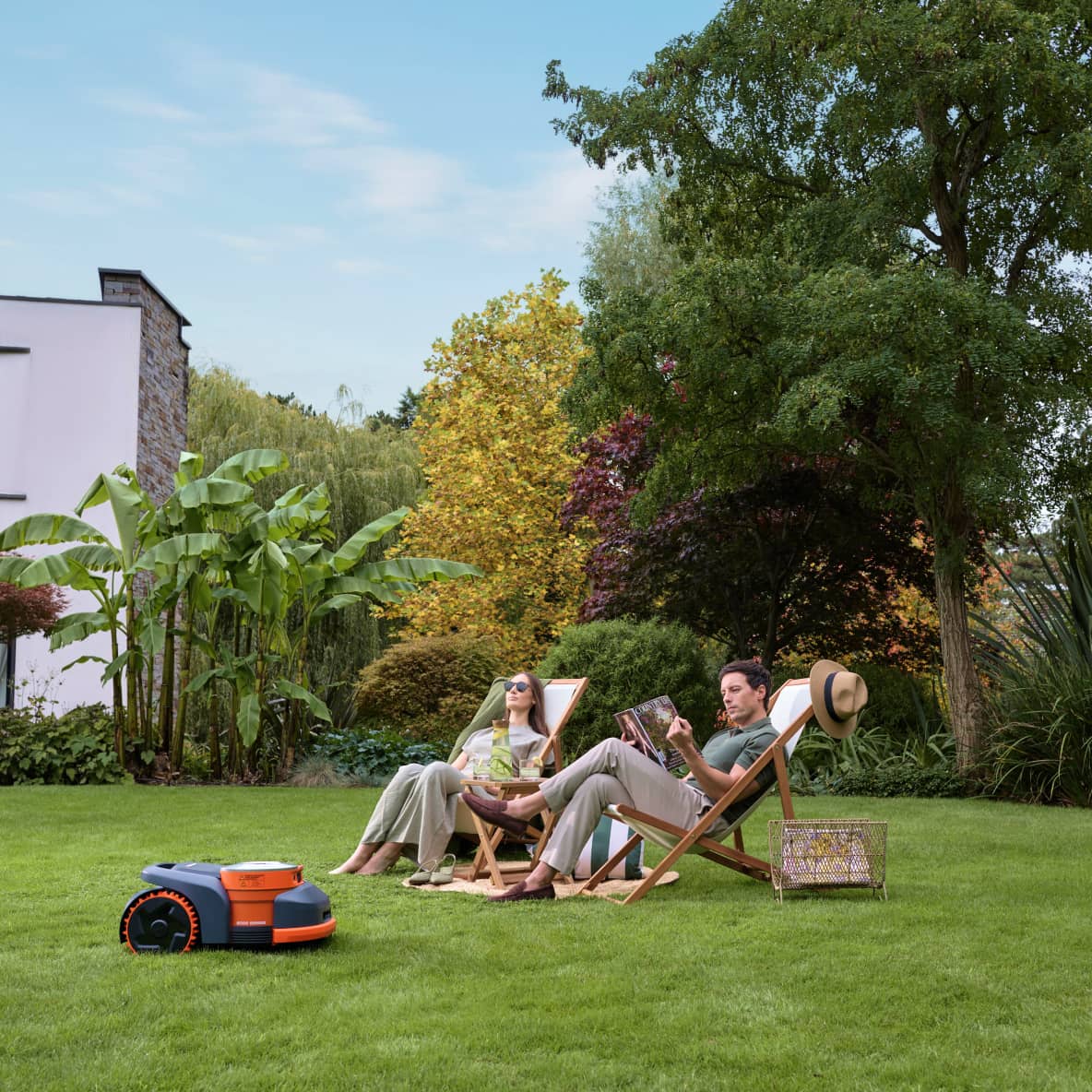 The Navimow i110N robot lawn mower mows the green lawn.