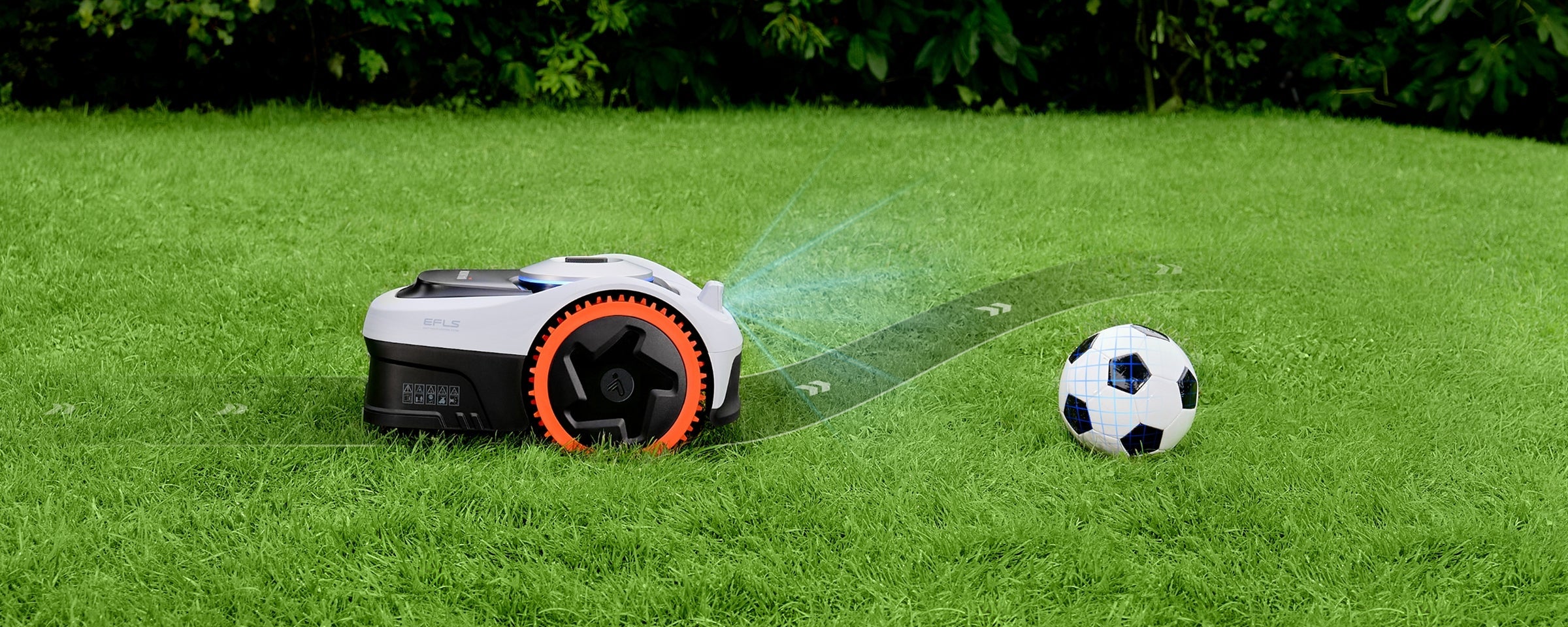 Navimow i Series robot lawn mower avoiding a soccer ball.