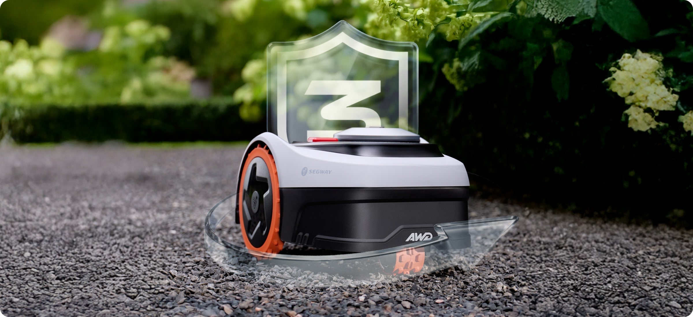 Segway Navimow i Series robot lawn mower on grey gravel.