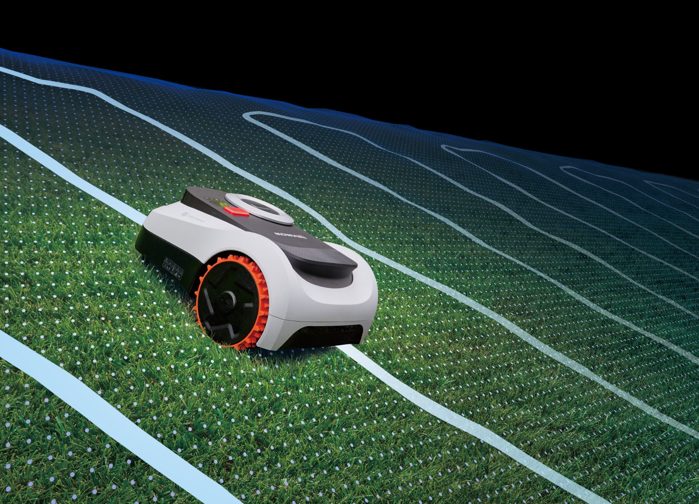 Segway Navimow robot lawn mower mows on a green hill.