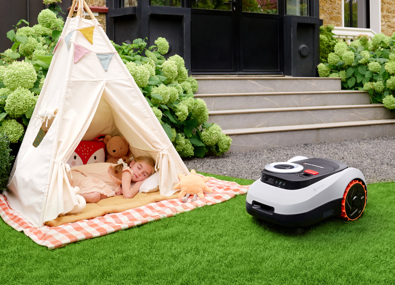 Segway Navimow i110E robot lawn mower near sleeping child in tent