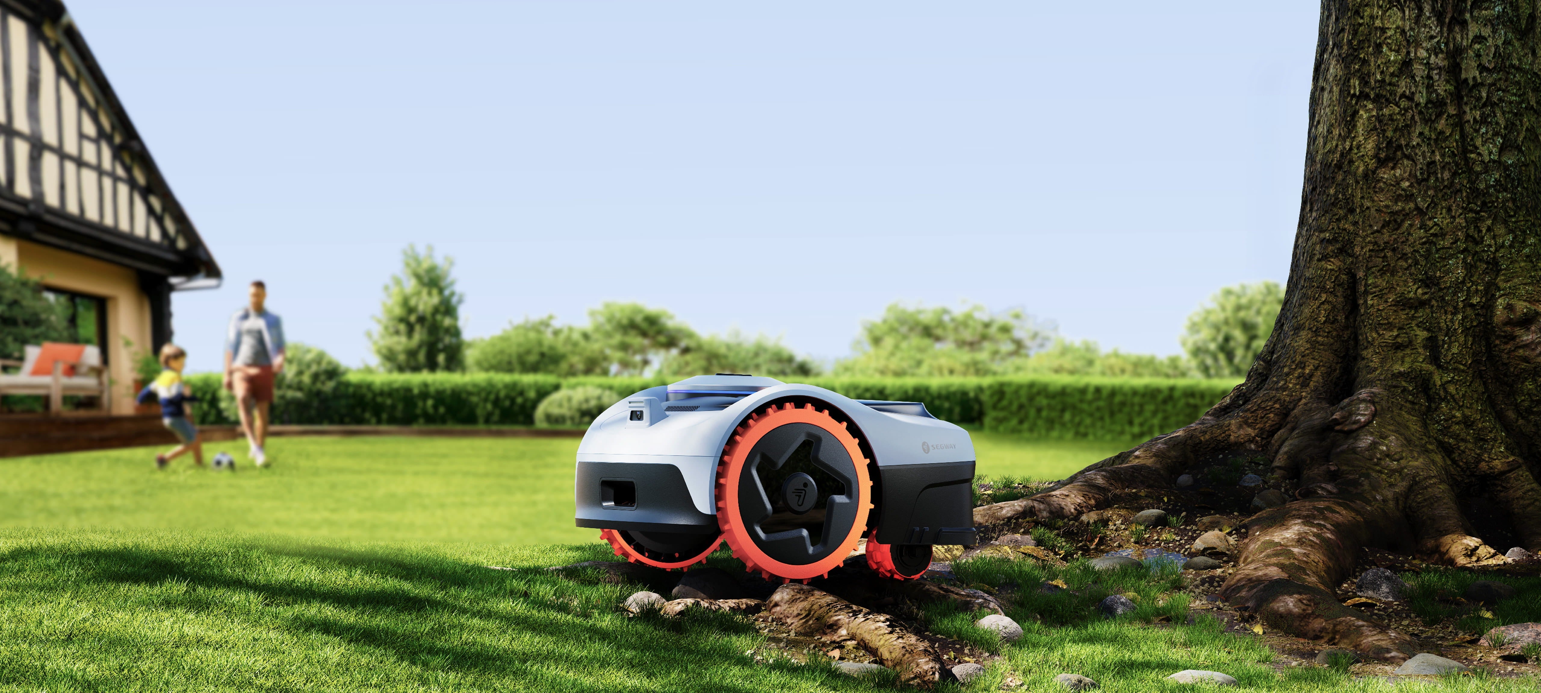 Segway Navimow i105E robot lawn mower on a green lawn.