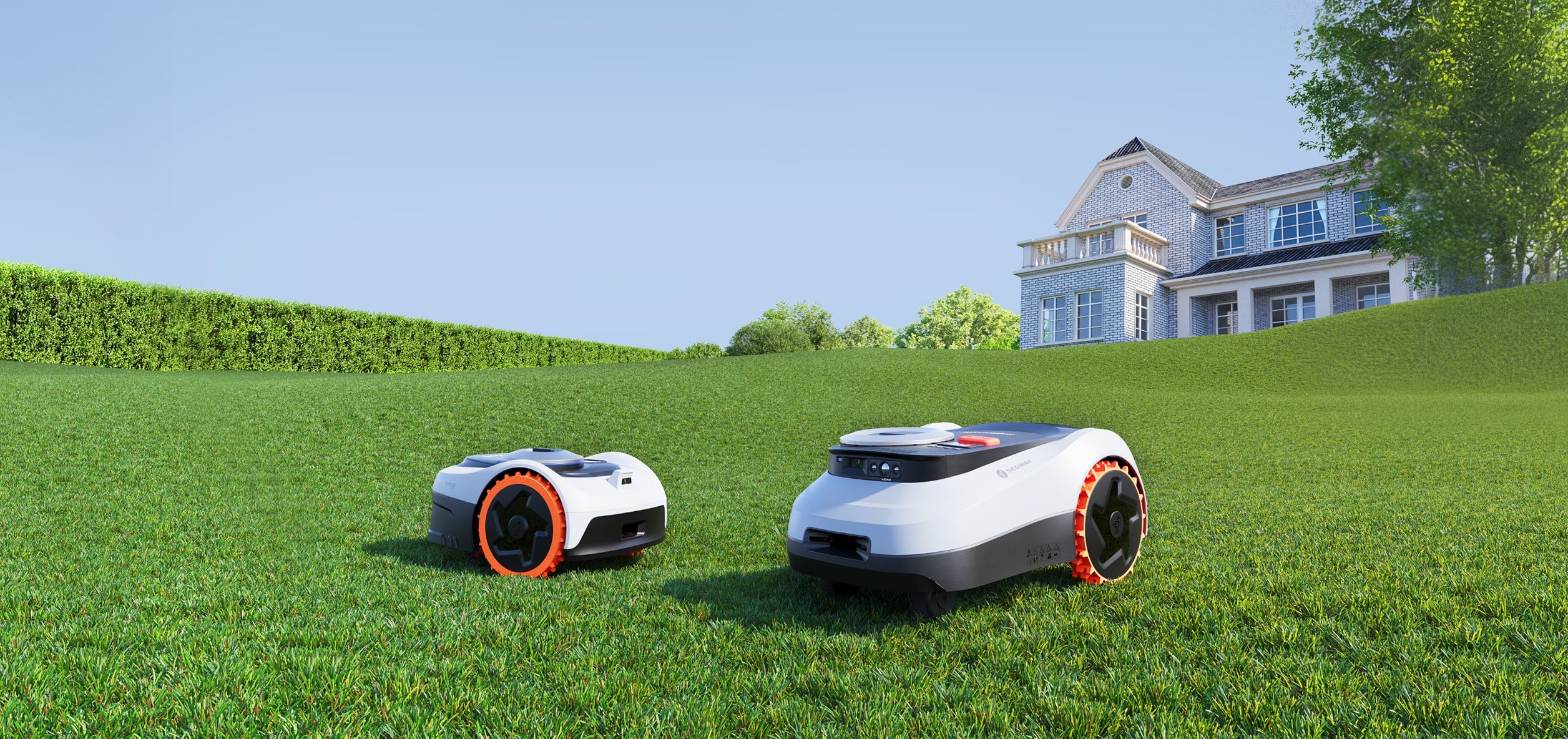Segway Navimow robot lawn mower on a bright green field.