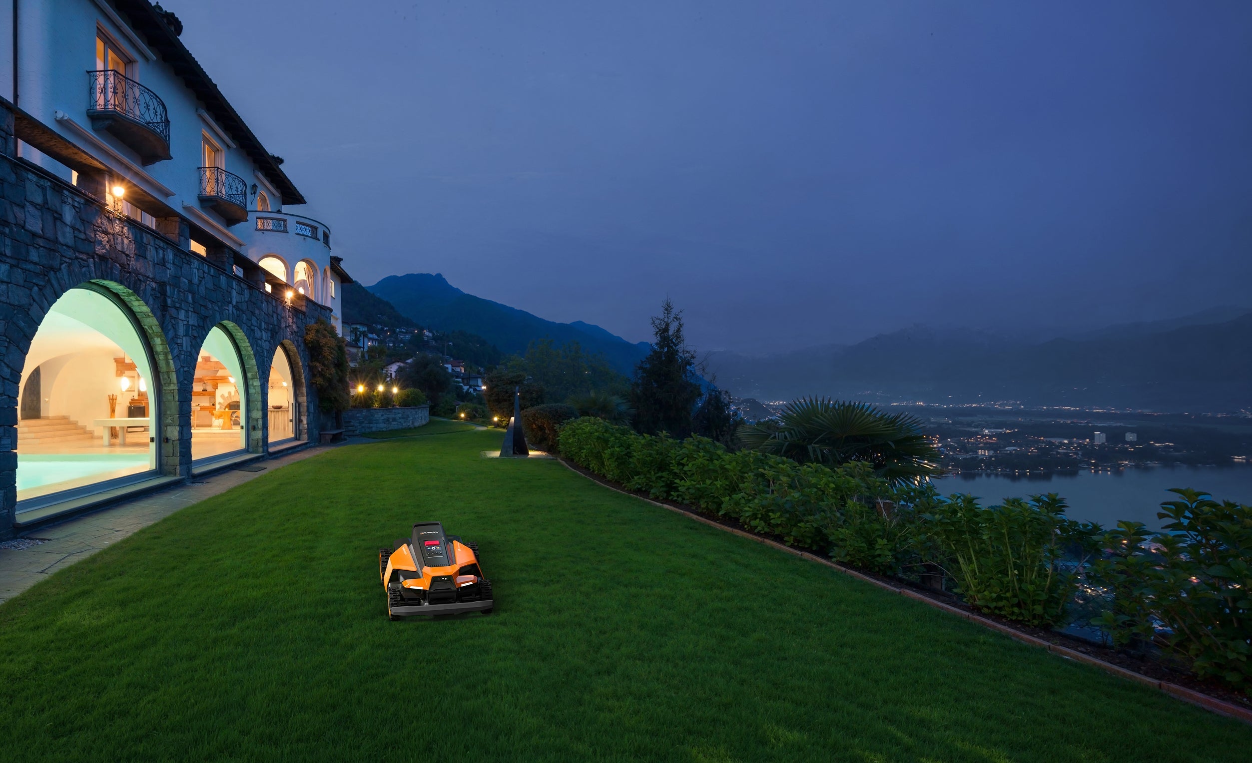 Navimow i110E robot lawn mower mows the villa's green grass.