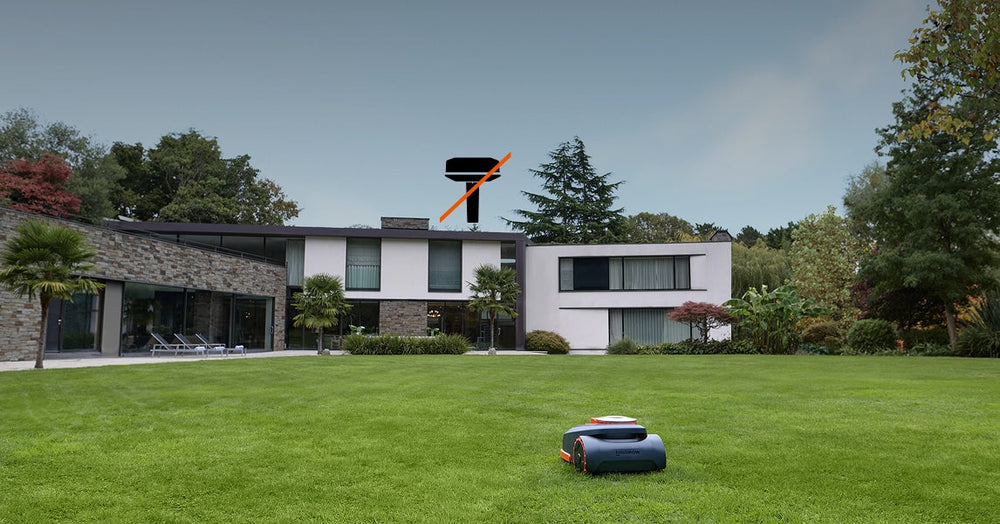 Navimow i105E robot lawn mower on a large green lawn.