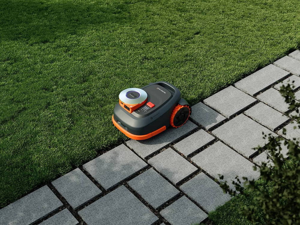 Navimow i105E robot lawn mower is mowing the green grass.