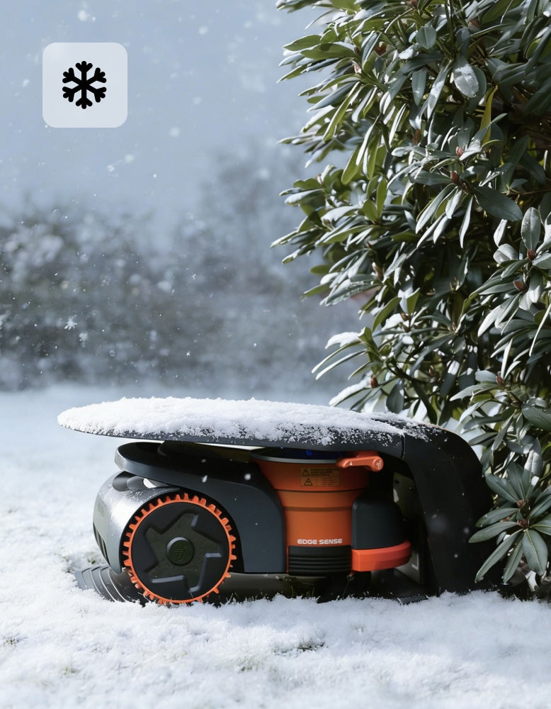 A Segway Navimow i110E robot lawn mower parked in snow.