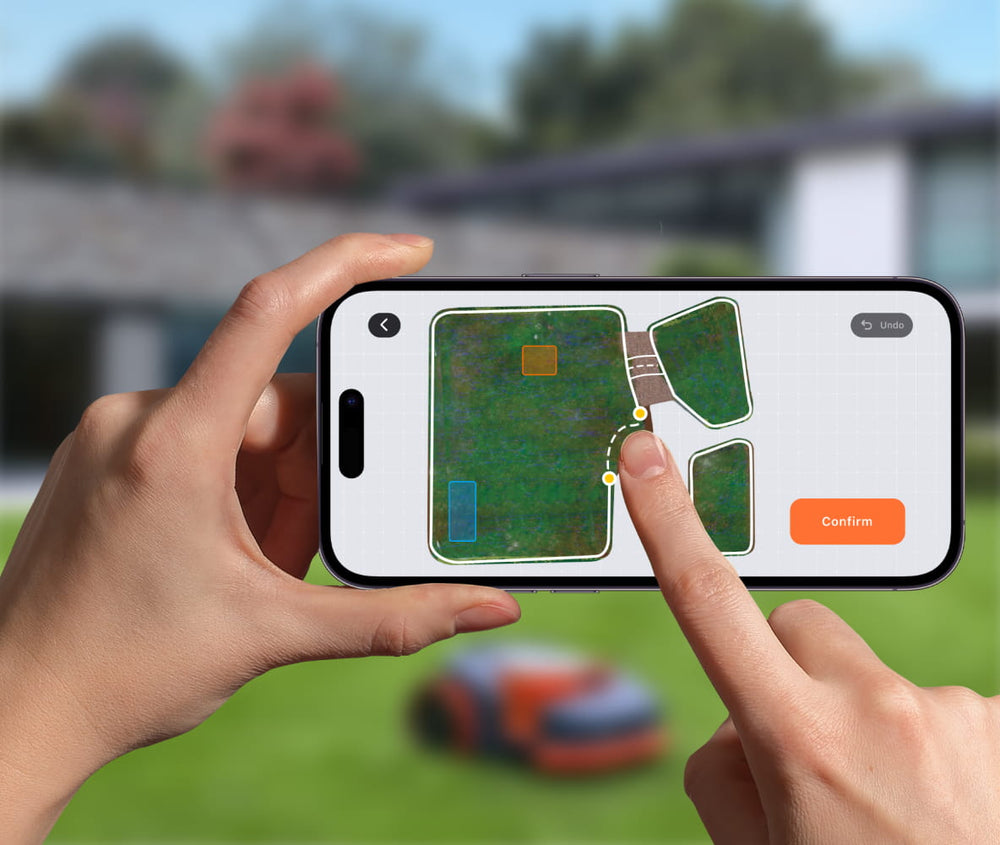 Navimow i110E robot lawn mower mapping a yard via app.