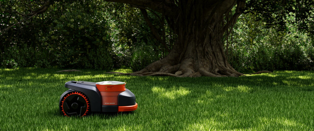 Segway Navimow i110N robot lawn mower on the green grass.