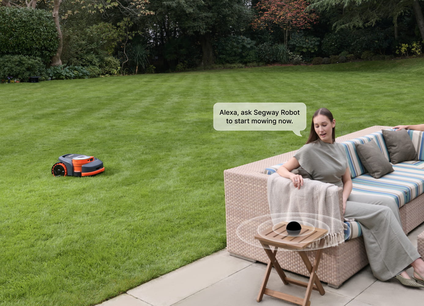 Woman uses Alexa to start Segway Navimow robot lawn mower.
