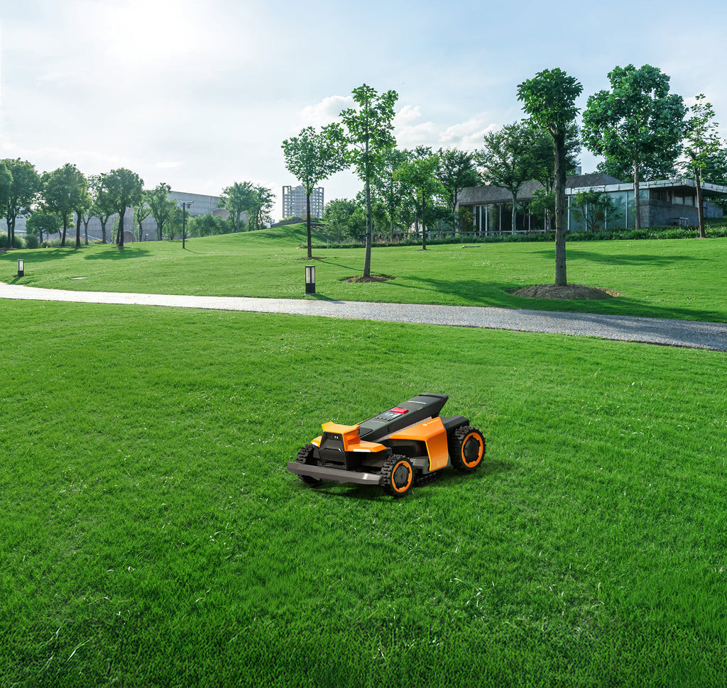 Navimow i110E robot lawn mower mows the lush green grass.