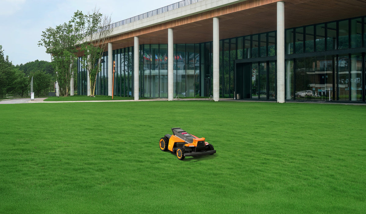 Navimow i110E robot lawn mower is on the green grass.
