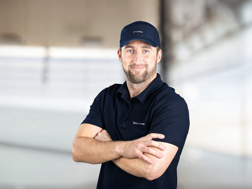 Navimow i105E robot lawn mower brand ambassador wearing official apparel.