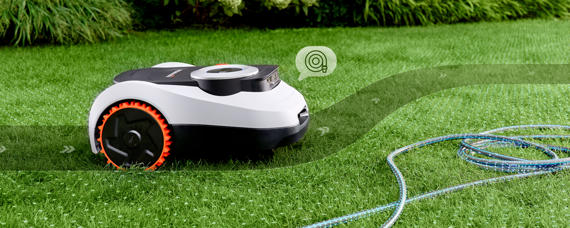 The Navimow i110N robot lawn mower avoids a garden hose.
