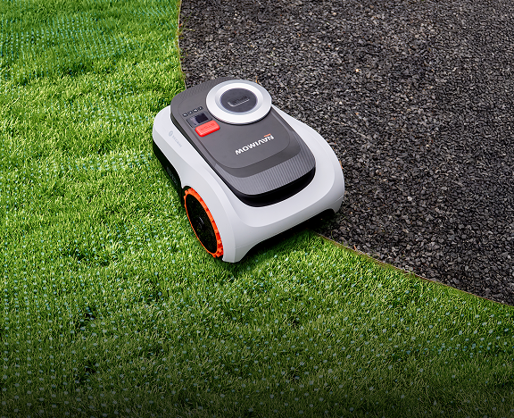 The Navimow i110E robot lawn mower is on green grass.