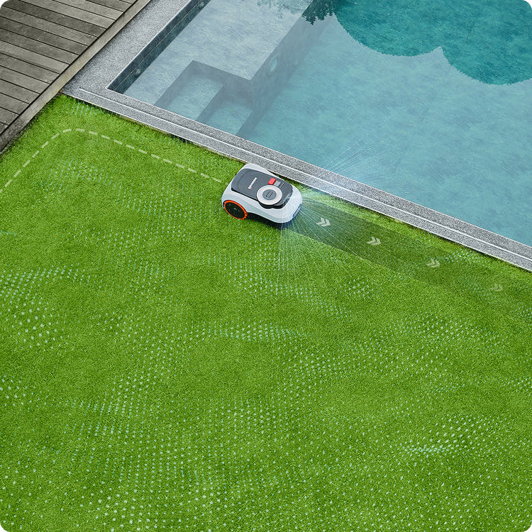 Navimow i110N robot lawn mower trims grass beside a pool.