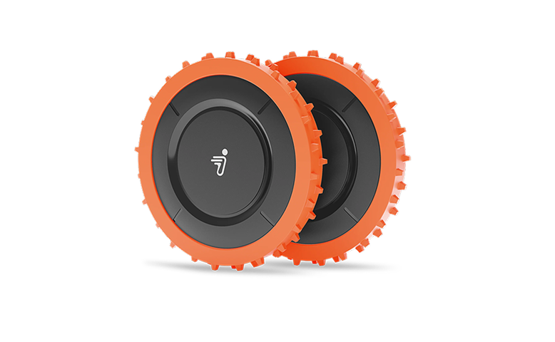 Navimow i105E robot lawn mower features two orange spiked wheels.