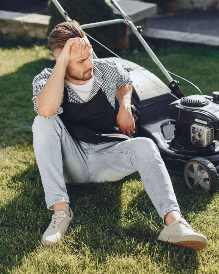 A tired man needs a Navimow i110E robot lawn mower.