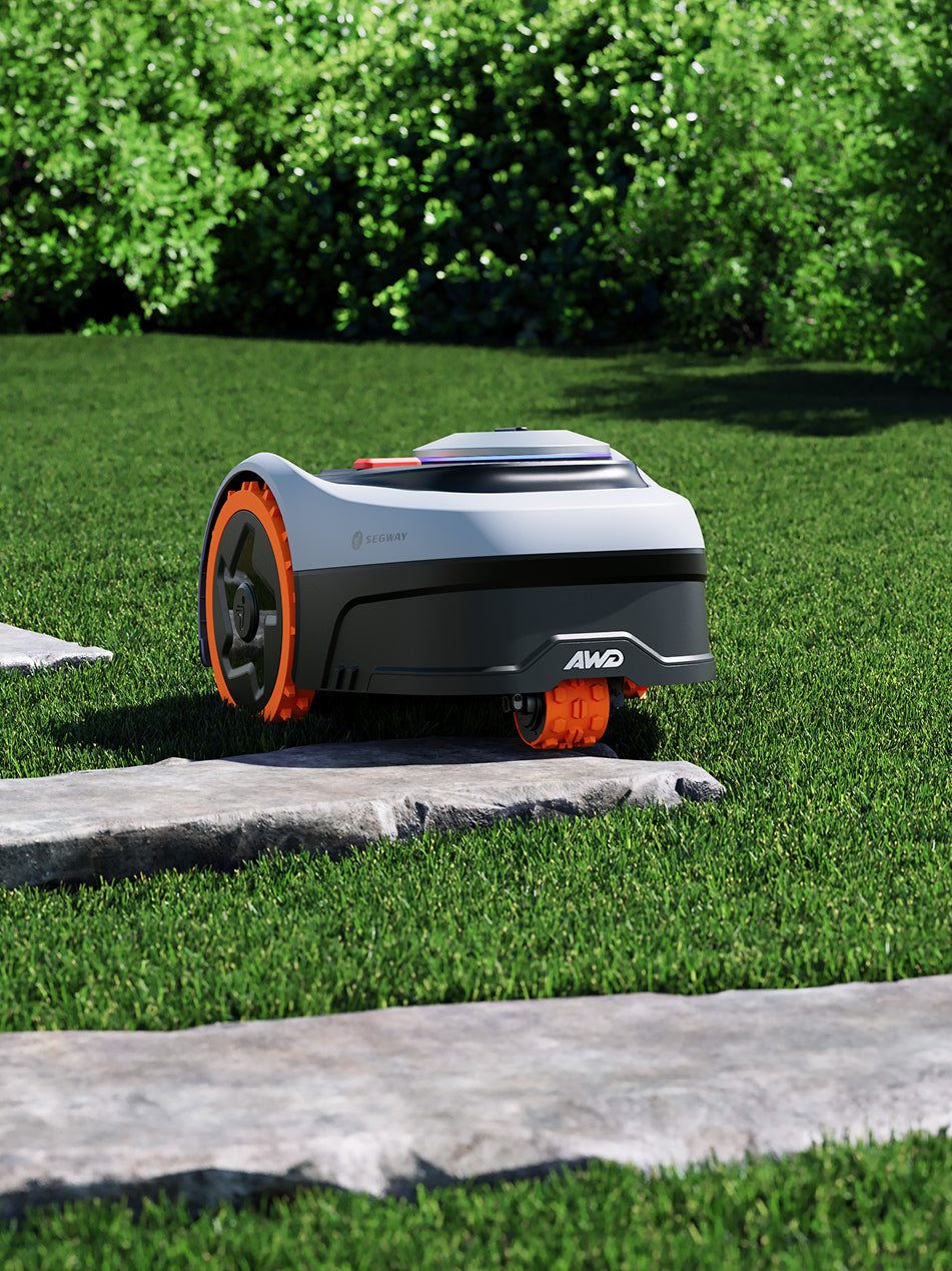 Segway Navimow i105E robot lawn mower on the green grass.