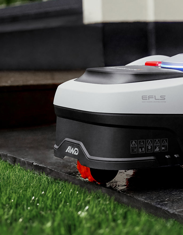 Segway Navimow H Series robot lawn mower on green grass.