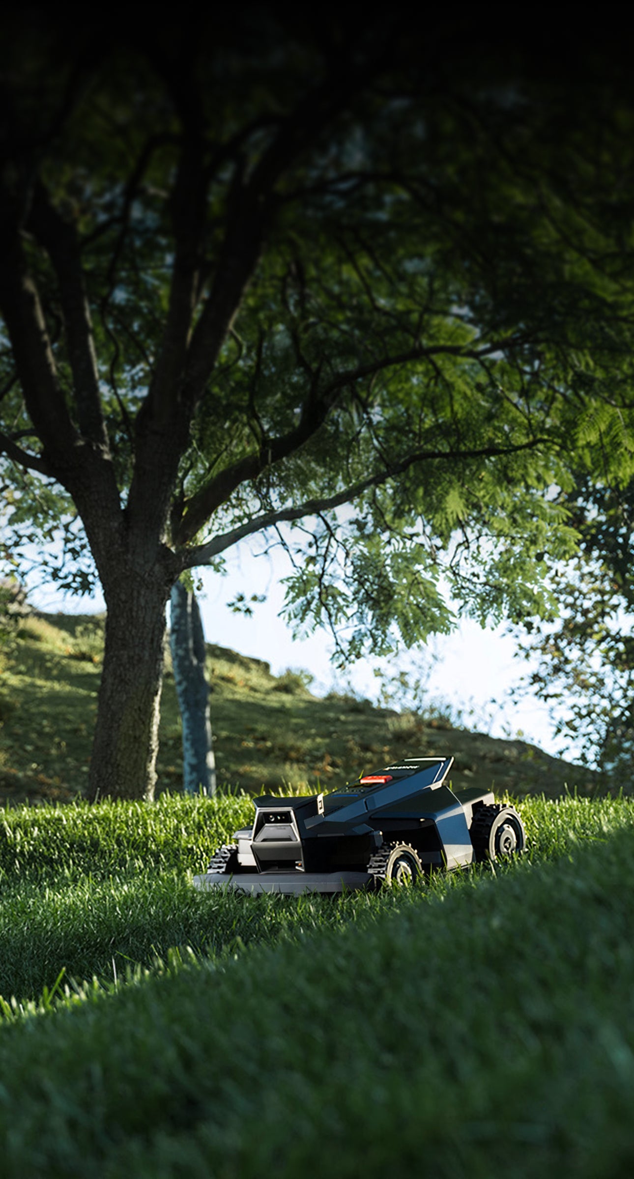 Navimow i110N robot lawn mower sits on a grassy hill.