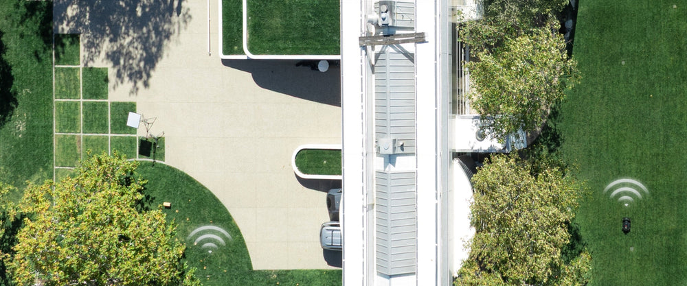 The Navimow i105E robot lawn mower is mowing green grass.
