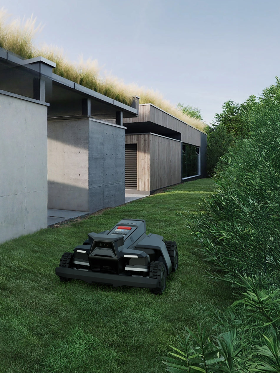 Navimow i110N robot lawn mower mows the green backyard grass.