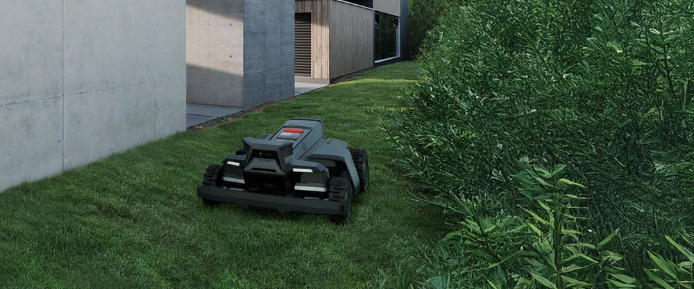 Navimow i110N robot lawn mower cuts grass in the backyard.